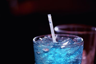 Close-up of drink over black background