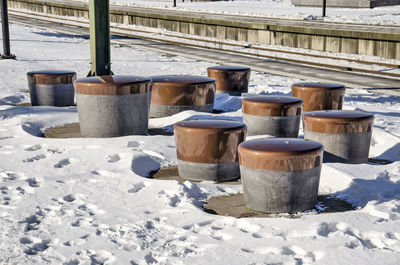 Seating elements on snowy railway platform