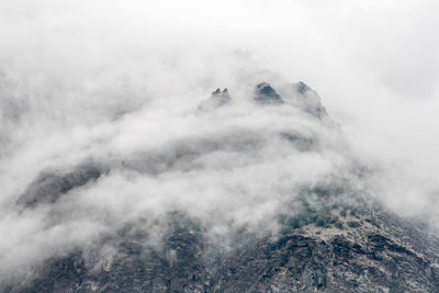 Mountain against sky during foggy weather