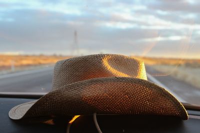 Close-up of hat on car dashboard