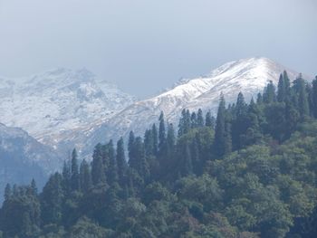 Scenic view of snow covered mountains against sky