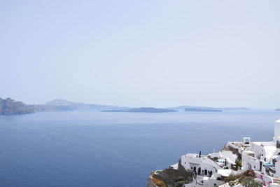 Panoramic view of sea and buildings against clear sky