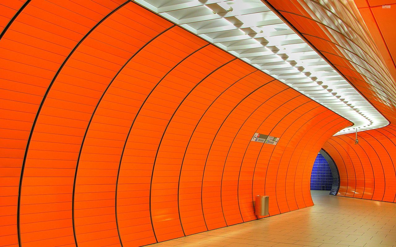 architecture, built structure, the way forward, indoors, arch, building exterior, wall - building feature, diminishing perspective, pattern, building, illuminated, tiled floor, one person, orange color, steps, yellow, wall, day, vanishing point, transportation