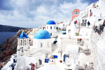 Panoramic view of buildings and sea against sky