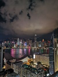 High angle view of illuminated buildings in city at night