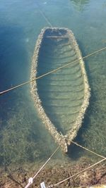 Sunk boat underwater at shore