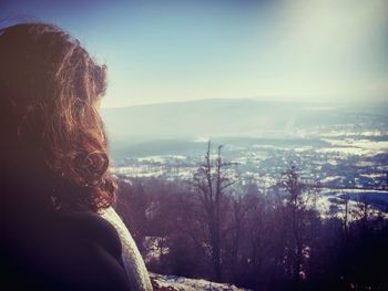 Rear view of woman against sky