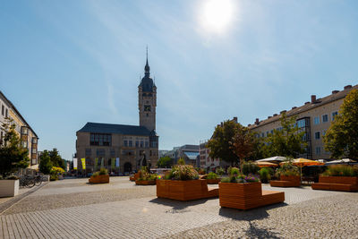 Panoramic view of buildings against sky on sunny day