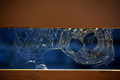 Close-up of broken glass on table
