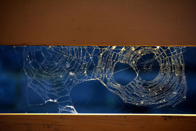 Close-up of broken glass on table