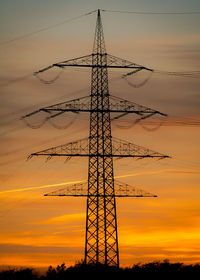 Low angle view of tower against dramatic sky