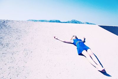 Full length of woman jumping in mid-air