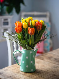 Close-up of tulip flower vase on table