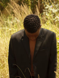 Young man standing in forest