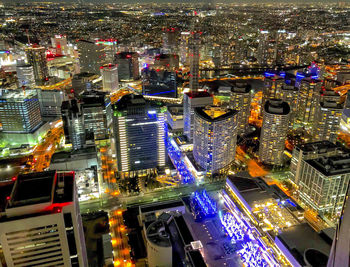 High angle view of illuminated buildings in city at night
