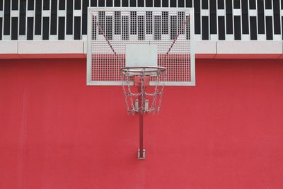 Close-up of telephone booth against building