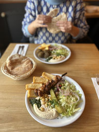 High angle view of food in plate on table at lunch in daylight 