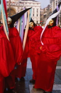 People in red costume during venice carnival