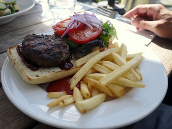 Close-up of burger and vegetables on table