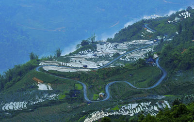 High angle view of trees and mountains against sky