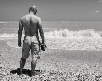 Woman standing on beach