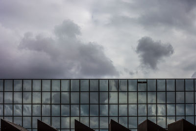 Full frame shot of modern building against cloudy sky