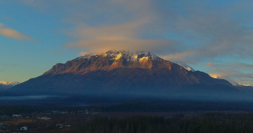 Scenic view of mountains against sky during sunset