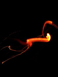 Close-up of illuminated light against black background