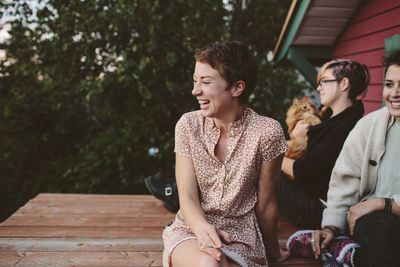 Happy friends relaxing on rooftop