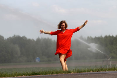 Full length of man standing on field against sky