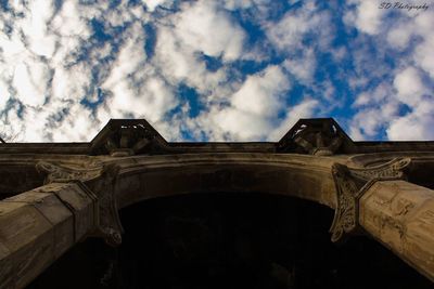 Low angle view of historical building against cloudy sky