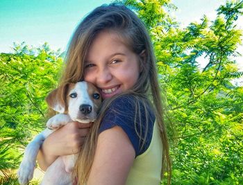 Portrait of smiling girl with dog