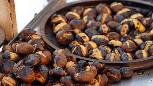 Fried chestnuts street food roasted and served in a special chestnut pan. istanbul, turkey