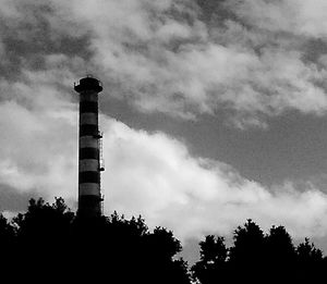 Low angle view of building against cloudy sky