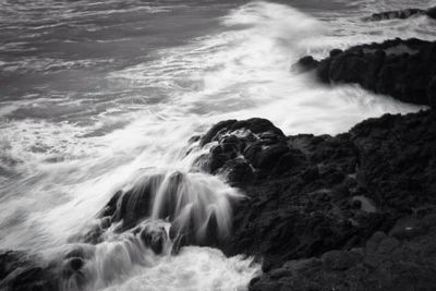Waves splashing on rocks