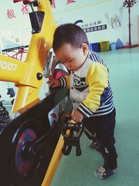 Boy playing with toy car