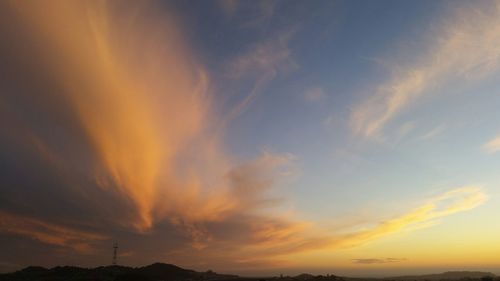 Scenic view of dramatic sky at sunset