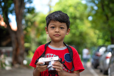 Portrait of boy holding ice cream