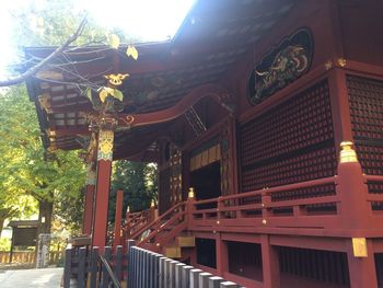 Low angle view of illuminated building at temple