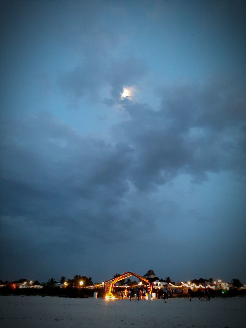 ILLUMINATED BUILDINGS AGAINST SKY