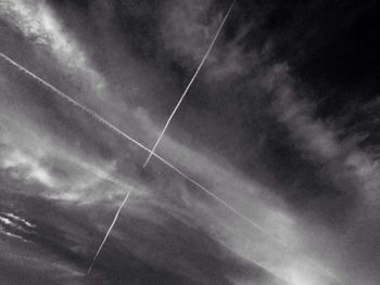 Low angle view of vapor trails in sky