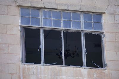 Low angle view of window on old building