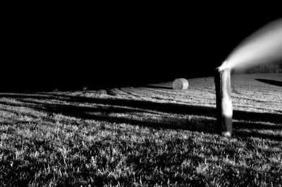 Scenic view of field against clear sky at night