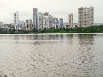 View of city buildings against sky