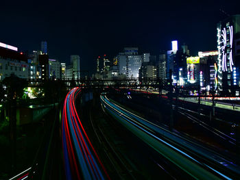 High angle view of light trails on road at night