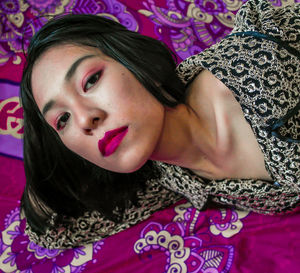 Portrait of beautiful woman lying down