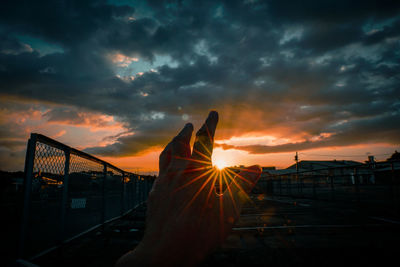 Silhouette built structure against sky during sunset