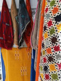 Colorful shawls hanging for sale at market