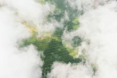 Aerial view of waterfall against sky