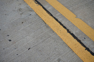 High angle view of road marking on wooden floor